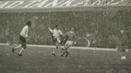 Don Givens fires in a shot in the Blackpool blizzard