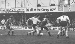 Viv Busby tries to dribble through