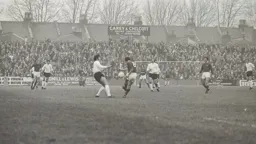 Don Givens tries to prevent a clearance