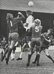 Viv Busby goes for the ball