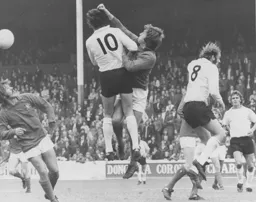 Vic Halom puts pressure on Jim Barron the Forest goalkeeper