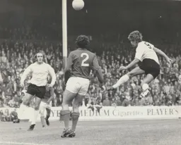 Viv Busby gets in a header