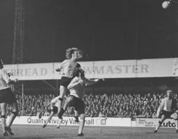 Rodney Fern is beaten to the ball