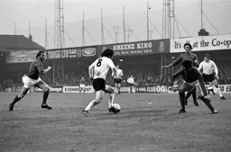 Graham French heads for goal