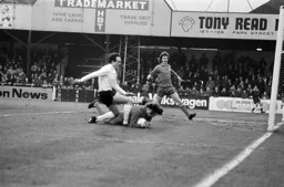 John Aston cannot get to the ball first