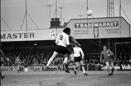 Barry Butlin challenges the Forest defender