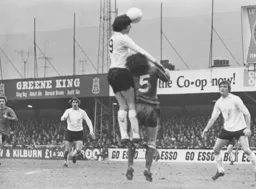 Barry Butlin heads back across goal