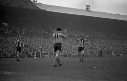 John Aston celebrates after his second goal