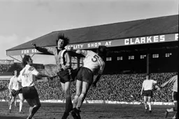 Barry Butlin outjumps the Bolton defence