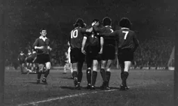 Team mates all congratulate John Aston