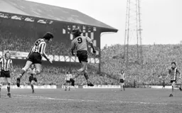 Viv Busby gets in a header