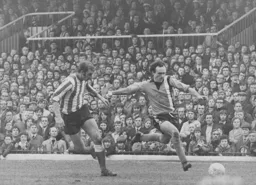 John Aston gets in a cross