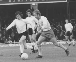 Gordon Hindson goes in to tackle Fulham's Barry Lloyd