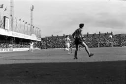 John Aston in behind