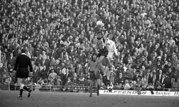Bobby Thomson rises highest against a back drop of expectant Hatters fans