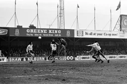 Barry Butlin heads for goal