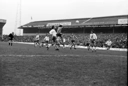 Peter Anderson gets his head to the ball