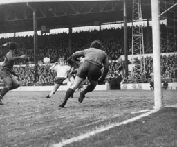 Alan West skews a shot wide