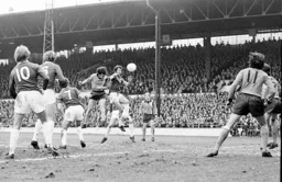 Peter Anderson out jumps Frank Worthington