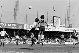 Barry Butlin rises above the defender