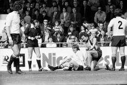 Jimmy Husband gets up as Graeme Souness looks on.
