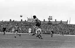 Barry Butlin heads across goal