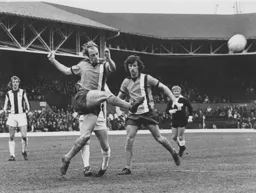 John Faulkner, later concussed, clears the ball