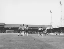 A free kick is swung in