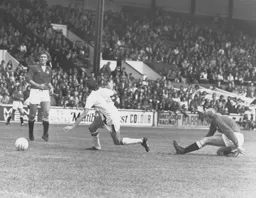 Barry Butlin slips as he gets clear