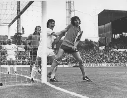 Barry Butlin is manhandled by Liverpool's Tommy Smith