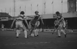 Barry Butlin is surrounded by Rangers defenders