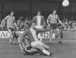 Jimmy Husband is prevented from reaching the ball