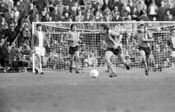 Jimmy Husband breaks over half way line watched by John Ryan and Alan West