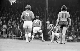 Alston watches John Faulkner clear the ball