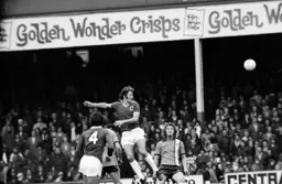 Leicester’s Frank Worthington rises to head watched by Steve Litt