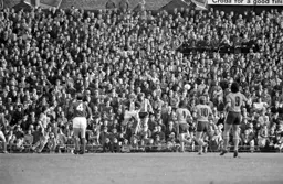 Steve Litt makes a defensive clearance from Kenny Burns