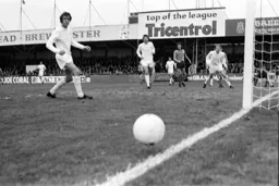 Spurs Mike England watches the ball go by the post