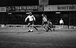 John Aston challenges Burnley defender