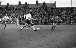 John Aston slots the ball through