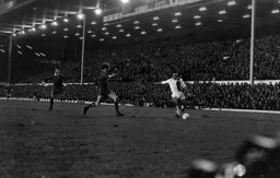 John Aston crosses at the Anfield Road End