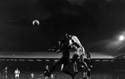 John Aston gets to the ball before Tommy Smith