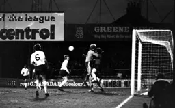 Ron Futcher collides with the Wanderers keeper