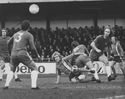 Ron Futcher is surrounded by Chelsea defenders