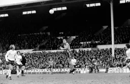 John Aston heads high above Spurs Phil Beal