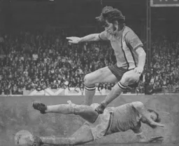 John Ryan rides a tackle