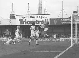 Ron Futcher challenges the Hull goalkeeper