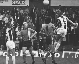 A West Brom defender heads clear