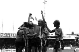 Town players celebrate with Ron Futcher