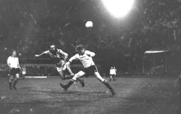 John Aston gets a header in