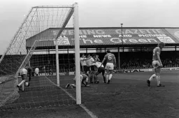 Blackpool keeper picks the ball out of the net after Peter Spiring scores the second